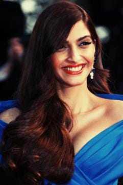 2015: Sonam Kapoor looked ravishing in this cobalt blue gown with matte orange lips, and gorgeous praline brown hair. She really made a bold statement on the red carpet with this look.