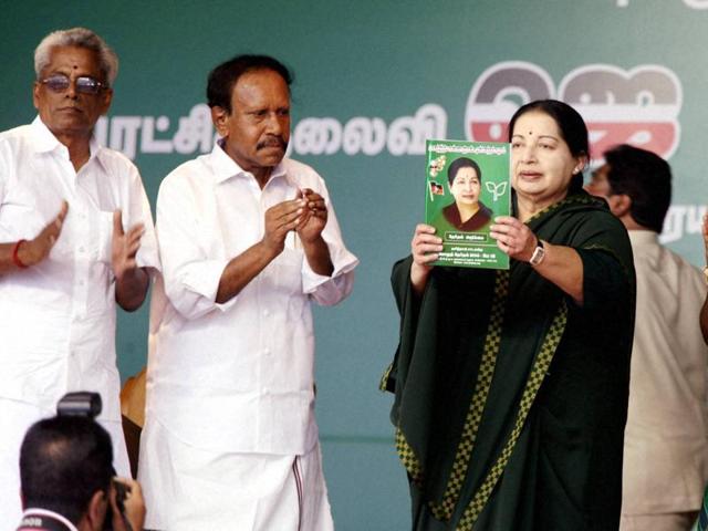 Tamil Nadu chief minister and AIADMK supremo J Jayalalithaa, with party leader M Thambidurai, releases the party's election manifesto in Perundurai. (PTI Photo)