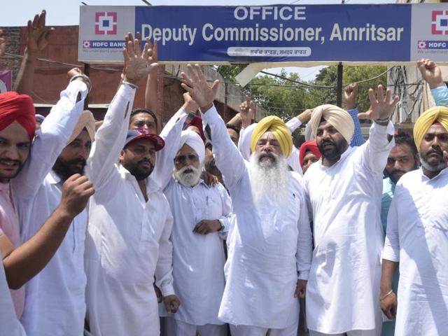 The district (rural) Congress protesting against the Punjab government outside the Amritsar deputy commissioner’s office on Monday. (Sameer Sehgal/HT Photo) The district (rural) Congress protesting against the Punjab government outside the Amritsar deputy commissioner’s office on Monday. (Sameer Sehgal/HT Photo)