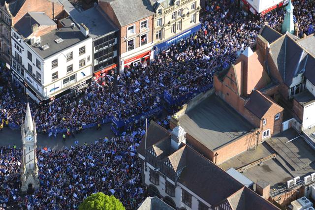 Leicester City team members celebrate winning the English Premier league title during the open top bus parade through downtown Leicester. (AP) Leicester City team members celebrate winning the English Premier league title during the open top bus parade through downtown Leicester. (AP)