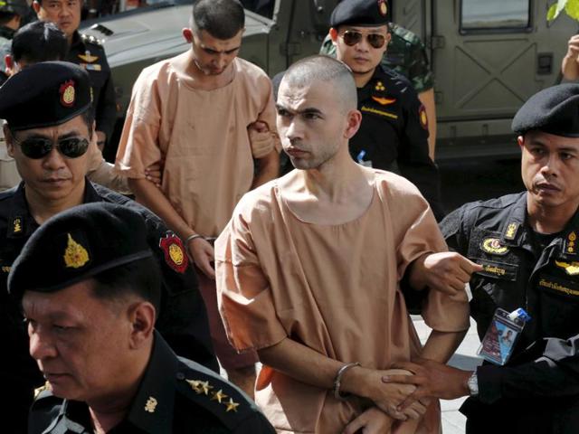 Bilal Mohammed (also known as Adem Karadag) and Yusufu Mieraili, both suspects of the Aug 17 Bangkok blast, being escorted as they arrive at the military court in Bangkok, Thailand, November 24, 2015.(Reuters) Bilal Mohammed (also known as Adem Karadag) and Yusufu Mieraili, both suspects of the Aug 17 Bangkok blast, being escorted as they arrive at the military court in Bangkok, Thailand, November 24, 2015.(Reuters)