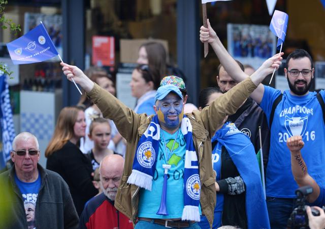 Leicester fans line the route as they wait for the team to take part in an open-top bus parade through Leicester to celebrate winnning the Premier League title. (AFP) Leicester fans line the route as they wait for the team to take part in an open-top bus parade through Leicester to celebrate winnning the Premier League title. (AFP)
