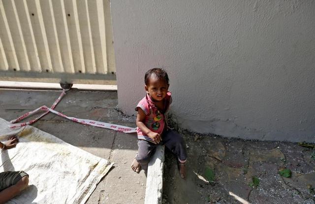 Barrier tape is tied around Shivani's ankle to prevent her from running away. (Reuters) Barrier tape is tied around Shivani's ankle to prevent her from running away. (Reuters)