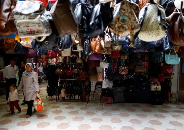 Shoppers walk in the main marketplace in the southeastern town of Kilis. (REUTERS) Shoppers walk in the main marketplace in the southeastern town of Kilis. (REUTERS)