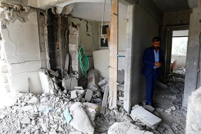 Omer Ciloglu stands inside his devastated house. (REUTERS) Omer Ciloglu stands inside his devastated house. (REUTERS)