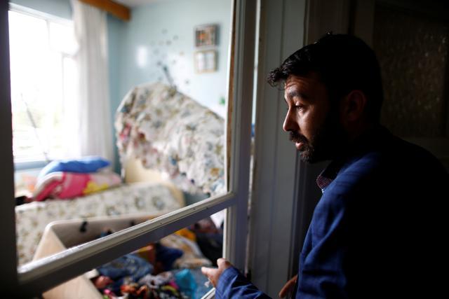 Omer Ciloglu stands inside his devastated house . (REUTERS) Omer Ciloglu stands inside his devastated house . (REUTERS)