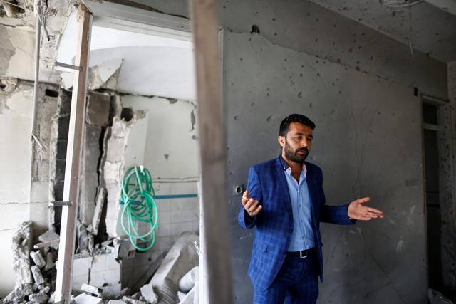 Omer Ciloglu stands inside his devastated house struck by a rocket from Syria in Turkey's southeastern border town of Kilis. (REUTERS) Omer Ciloglu stands inside his devastated house struck by a rocket from Syria in Turkey's southeastern border town of Kilis. (REUTERS)