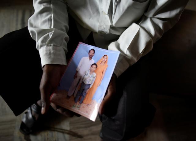 Ram Singh from Sohna, Gurgaon, holds a picture of his son Ankit (11) who had gone missing in New Delhi. (Ravi Choudhary/HT Photo) Ram Singh from Sohna, Gurgaon, holds a picture of his son Ankit (11) who had gone missing in New Delhi. (Ravi Choudhary/HT Photo)