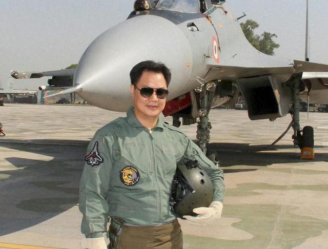 Minister of state for home Kiren Rijiju with a fighter pilot after a raid on board Sukhoi 30-MKI. (PTI) Minister of state for home Kiren Rijiju with a fighter pilot after a raid on board Sukhoi 30-MKI. (PTI)