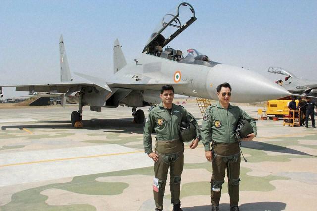 Kiren Rijiju with an IAF fighter pilot. (PTI) Kiren Rijiju with an IAF fighter pilot. (PTI)