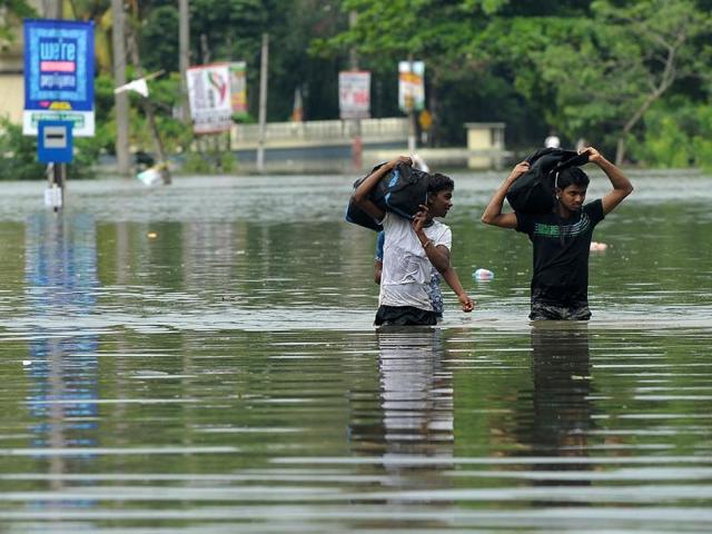A Sri Lankan man wades through floodwaters in Kelaniya suburb of the capital Colombo on Wednesday. (AFP) A Sri Lankan man wades through floodwaters in Kelaniya suburb of the capital Colombo on Wednesday. (AFP)