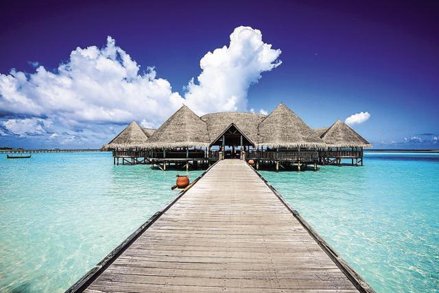 Six Senses Laamu is picture-postcard pretty: bluest of blue skies, soft white sand, palm trees and water villas Six Senses Laamu is picture-postcard pretty: bluest of blue skies, soft white sand, palm trees and water villas