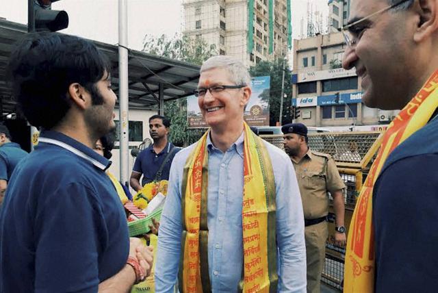 Apple’s CEO Tim Cook interacts with Anant Ambani, son of industrialist Mukesh Ambani, outside Siddhivinayak Temple in Mumbai on Wednesday. Apple India head Sanjay Kaul is also seen in the picture. (PTI) Apple’s CEO Tim Cook interacts with Anant Ambani, son of industrialist Mukesh Ambani, outside Siddhivinayak Temple in Mumbai on Wednesday. Apple India head Sanjay Kaul is also seen in the picture. (PTI)