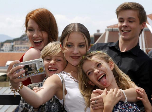 Actors (L-R) Annalise Basso, Charlie Shotwell, Samantha Isler, Shree Crooks and Nicholas Hamilton take a selfie as they pose during a photocall for the film Captain Fantastic in competition for the category Un Certain Regard at the 69th Cannes Film Festival in Cannes. (REUTERS) Actors (L-R) Annalise Basso, Charlie Shotwell, Samantha Isler, Shree Crooks and Nicholas Hamilton take a selfie as they pose during a photocall for the film Captain Fantastic in competition for the category Un Certain Regard at the 69th Cannes Film Festival in Cannes. (REUTERS)