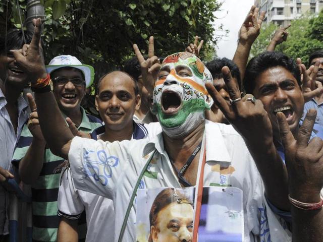 TMC supporters and workers celebrating their win outside the counting centre at Alipur in South Kolkata. PM Narendra Modi has congratulated TMC chief Mamata Banerjee as early trends suggested a major victory for the party. (Photo by Subhendu Ghosh/ Hindustan Times)