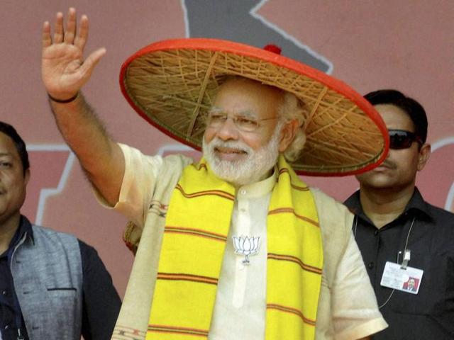 File photo of Prime Minister Narendra Modi wearing an Assamese japi' at an election rally. (PTI File Photo) File photo of Prime Minister Narendra Modi wearing an Assamese japi' at an election rally. (PTI File Photo)