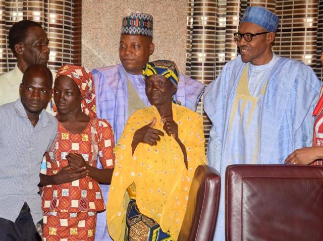Amina Ali, the rescued Chibok schoolgirl (second left, front row), and her family members pose with Nigeria's President Muhammadu Buhari, right, and Borno state governor Kashim Shettima, centre, at the Presidential palace in Abuja, Nigeria. (AP) Amina Ali, the rescued Chibok schoolgirl (second left, front row), and her family members pose with Nigeria's President Muhammadu Buhari, right, and Borno state governor Kashim Shettima, centre, at the Presidential palace in Abuja, Nigeria. (AP)