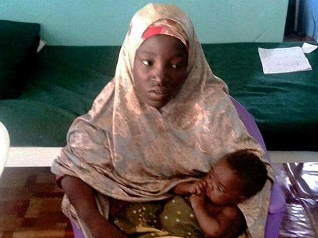 Amina Ali poses with her 4-month old baby Safiya, one of 219 girls abducted from their school in Chibok more than two years ago, after she was released by Nigeria's army. (AFP Photo) Amina Ali poses with her 4-month old baby Safiya, one of 219 girls abducted from their school in Chibok more than two years ago, after she was released by Nigeria's army. (AFP Photo)