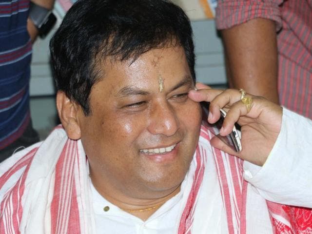 BJP chief ministerial candidate Sarbananda Sonowal along with BJP leaders Ram Madhav (R) and Himanta Biswa Sarma addressing the media in Guwahati after the party's win the Assam Assembly polls, March 19, 2016(PTI)