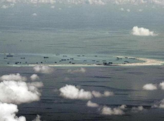 An aerial photo taken though a glass window of a Philippine military plane shows the alleged on-going land reclamation by China on mischief reef in the Spratly Islands in the South China Sea, west of Palawan, Philippines. (Reuters) An aerial photo taken though a glass window of a Philippine military plane shows the alleged on-going land reclamation by China on mischief reef in the Spratly Islands in the South China Sea, west of Palawan, Philippines. (Reuters)
