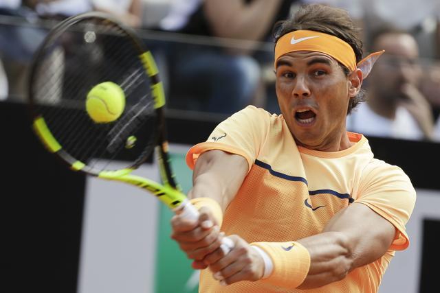 Rafael Nadal of Spain returns the ball to Nick Kyrgios of Australia during their match at the Italian Open. (AP Photo) Rafael Nadal of Spain returns the ball to Nick Kyrgios of Australia during their match at the Italian Open. (AP Photo)