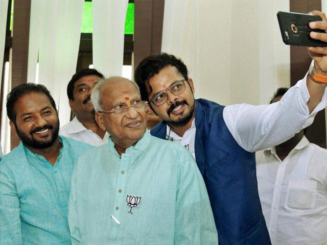 BJP's Thiruvananthapuram central candidate S Sreesanth takes a selfie with the party's winning candidate O Rajagopal at the party headquarters in Thiruvananthapuram. (PTI) 