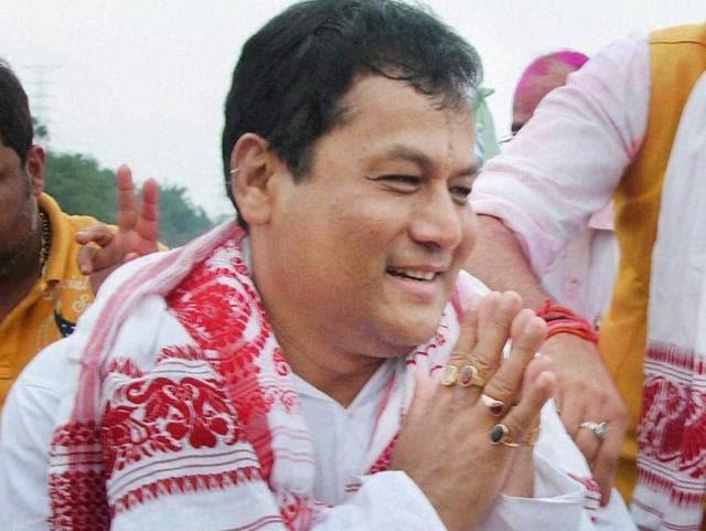 BJP’s chief ministerial candidate Sarbananda Sonowal greets supporters at a victory procession after the party's thumping win the Assam Assembly polls. (PTI) 