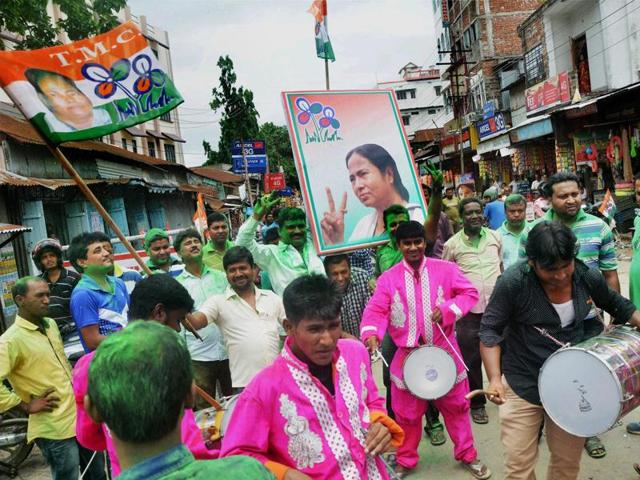 Agartala: Trinamool Congress supporters celebrate the party's win in West Bengal assembly elections, in Tripura's Agartala on Thursday. PTI Photo (PTI5_19_2016_000071B) (PTI)