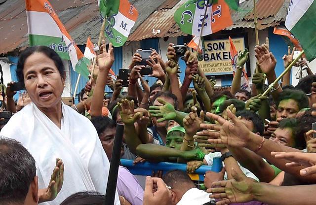 West Bengal chief minister Mamata Banerjee meets her supporters after the Trinamool Congress’ thumping win in the West Bengal assembly elections, in Kolkata. (PTI) West Bengal chief minister Mamata Banerjee meets her supporters after the Trinamool Congress’ thumping win in the West Bengal assembly elections, in Kolkata. (PTI)