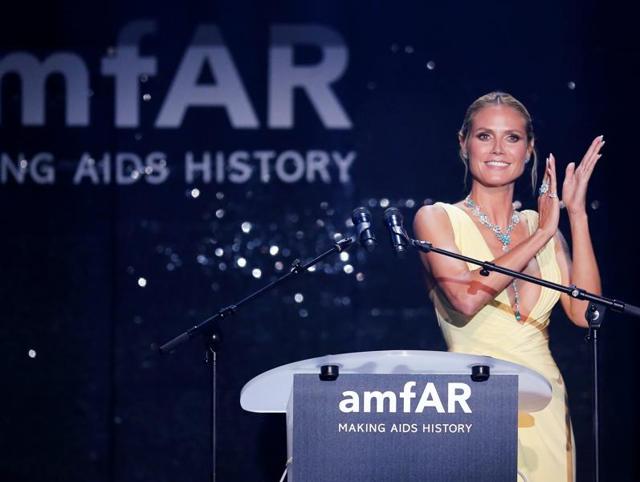 Supermodel and TV show host Heidi Klum conducts an auction. (REUTERS) Supermodel and TV show host Heidi Klum conducts an auction. (REUTERS)