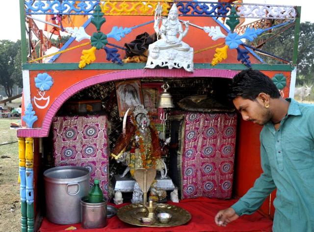 Idols they carry include those of Sai Baba, Durga, Krishna and Shiva. (Ravi Kumar/HT Photo)
