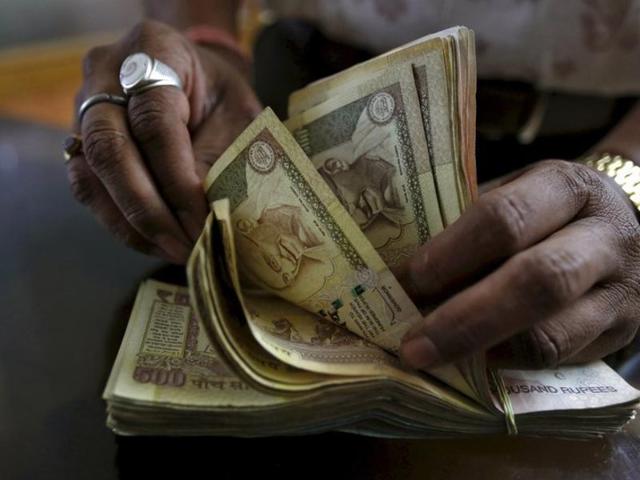 The rupee hovered in a range of 67.31 per dollar and 67.50 per dollar during the day on Friday. (REUTERS File Photo) The rupee hovered in a range of 67.31 per dollar and 67.50 per dollar during the day on Friday. (REUTERS File Photo)