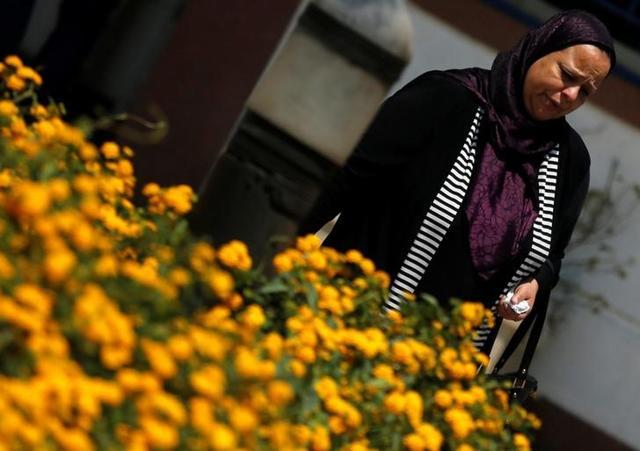 A relative of a crew member of an EgyptAir plane, which vanished from radar en route from Paris to Cairo, reacts as she arrives outside the Egyptair in-flight service building. (Reuters) A relative of a crew member of an EgyptAir plane, which vanished from radar en route from Paris to Cairo, reacts as she arrives outside the Egyptair in-flight service building. (Reuters)