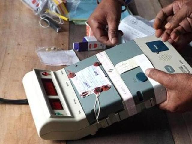 Election Commission officials seal an Electronic Voting Machine (EVM) prior to the start of voting at a polling station in Dibrugarh, Assam. (AFP photo) Election Commission officials seal an Electronic Voting Machine (EVM) prior to the start of voting at a polling station in Dibrugarh, Assam. (AFP photo)