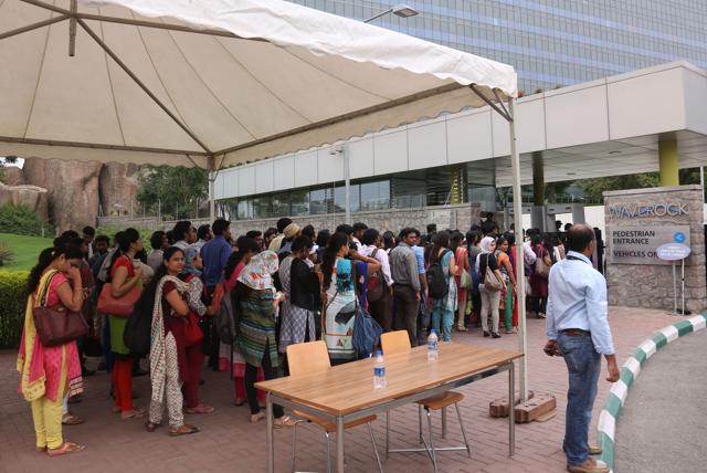 Employee queue up for security check before entering Waverock Apple development office in Hyderabad, India. (AP) Employee queue up for security check before entering Waverock Apple development office in Hyderabad, India. (AP)