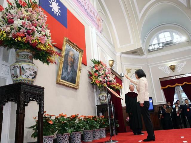 Taiwan's new President Tsai Ing-wen (left) and vice president Chen Chien-jen wave during their inauguration ceremonies in Taipei on Friday. (AP) Taiwan's new President Tsai Ing-wen (left) and vice president Chen Chien-jen wave during their inauguration ceremonies in Taipei on Friday. (AP)