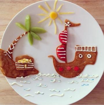 Ahoy mateys! Here is a pirate ship on a plate made by pancakes,creams and fruits. (Instagram/freeandwildchild) 