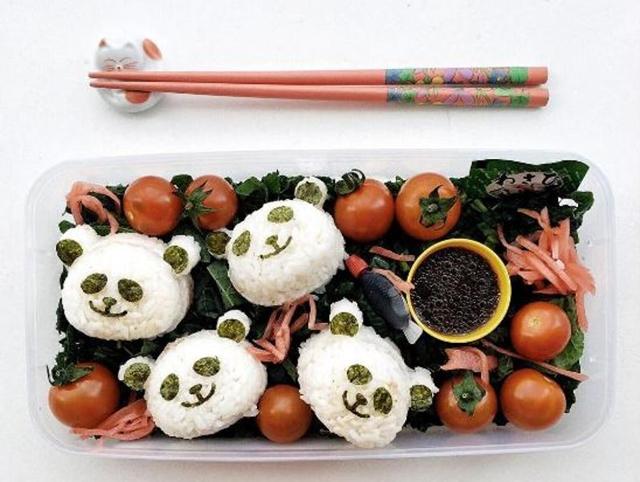 Fancy a panda? Or four? Lunchbox pimping with Panda Onigiri on a bed of kale salad. Healthy food made cute! (Instagram/addymcfly) 