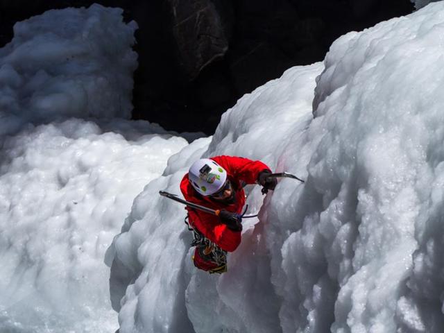 Climber Abhijeet Singh scaling the frozen waterfall.(Gaurav Rathi/The Morpheus Productions)