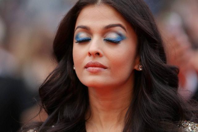 Aishwarya Rai Bachchan says the blue eye shadow on my gold dress evoked a positive response. (AP) Aishwarya Rai Bachchan says the blue eye shadow on my gold dress evoked a positive response. (AP)