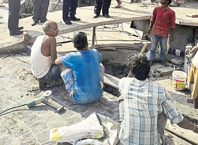 A team of labour officials interacting with labourers at a construction site in SBS Nagar.(HT Photo)