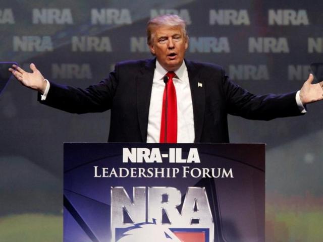 Republican presidential candidate Donald Trump addresses members of the National Rifle Association during their annual meeting in Louisville, Kentucky on Friday. (REUTERS) Republican presidential candidate Donald Trump addresses members of the National Rifle Association during their annual meeting in Louisville, Kentucky on Friday. (REUTERS)