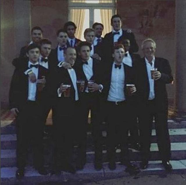 The boys celebrate with a drink. (Instagram)