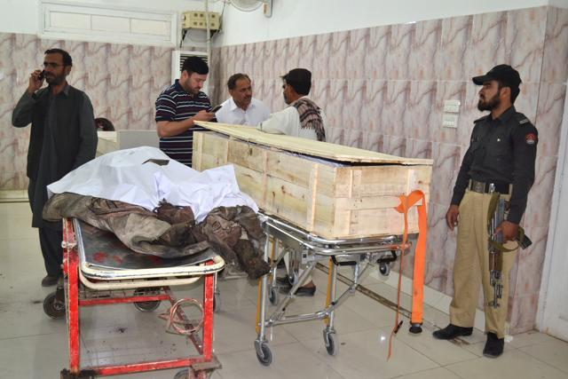 A Pakistani police officer and paramedics stand beside two dead bodies reportedly killed in a US drone strike in the Ahmad Wal area in Baluchistan province, Pakistan, at a hopsital in Quetta, Pakistan. (AP Photo) A Pakistani police officer and paramedics stand beside two dead bodies reportedly killed in a US drone strike in the Ahmad Wal area in Baluchistan province, Pakistan, at a hopsital in Quetta, Pakistan. (AP Photo)