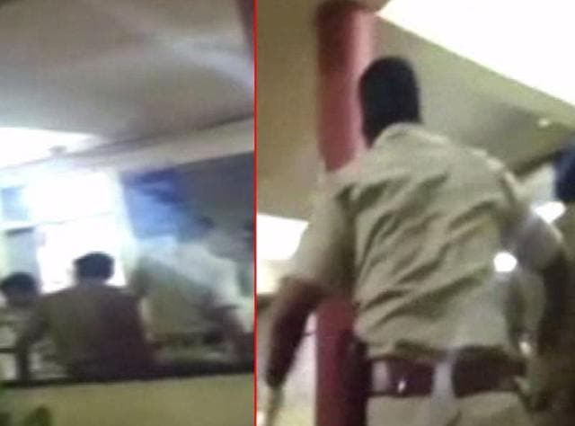 Witness’ video shows the police officer hitting the woman with a wooden stick inside the police station. (Screengrab) Witness’ video shows the police officer hitting the woman with a wooden stick inside the police station. (Screengrab)