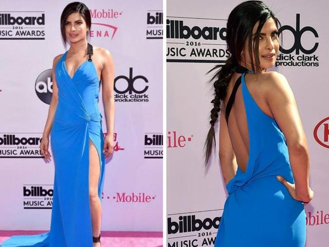 And Priyanka Chopra did it in again: This time she slayed at the Billboard Music Awards red carpet in a backless blue gown by Versace with a thigh-high slit.