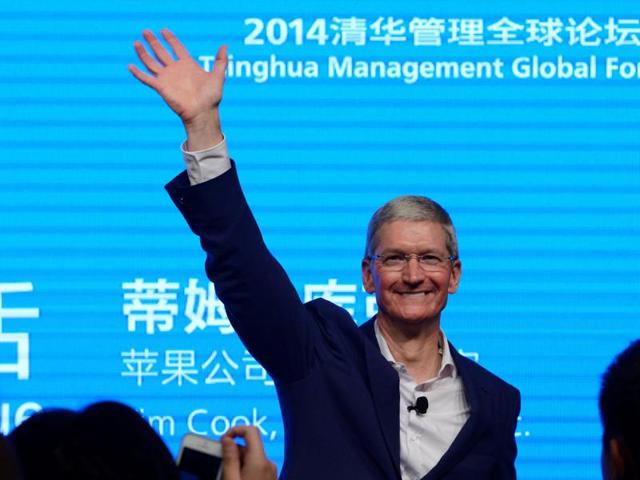 Apple CEO Tim Cook waves as he attends a talk in Beijing.(Reuters File Photo) Apple CEO Tim Cook waves as he attends a talk in Beijing.(Reuters File Photo)