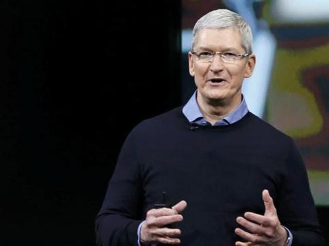 Connecting with the masses of India: Apple CEO Tim Cook with Bollywood stars Shah Rukh Khan and Amitabh Bachchan (Reuters Photo) Connecting with the masses of India: Apple CEO Tim Cook with Bollywood stars Shah Rukh Khan and Amitabh Bachchan (Reuters Photo)