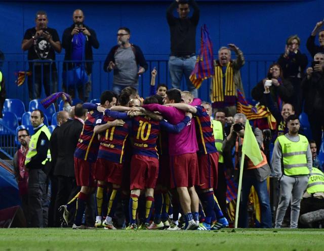 Barcelona players celebrate after a goal against Sevilla. (AFP) Barcelona players celebrate after a goal against Sevilla. (AFP)