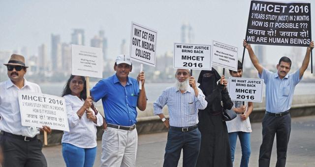 Parents of medical entrance examinees form a human chain to protest against the verdict of Supreme Court's on National Eligibility Entrance Test (NEET) in Mumbai. (PTI file photo) Parents of medical entrance examinees form a human chain to protest against the verdict of Supreme Court's on National Eligibility Entrance Test (NEET) in Mumbai. (PTI file photo)